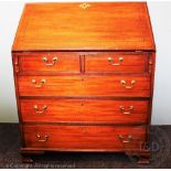 A 19th century inlaid mahogany bureau, with fall above two short and three long drawer,