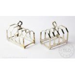 A pair of silver toast racks, Viners Ltd, Sheffield 1932, each of four division form, 7.
