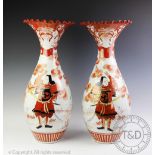 A large pair of Japanese kutani vases, decorated with figures and flowers, with a shaped rim,