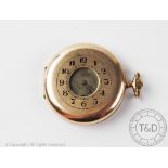 A gentleman's 9 carat gold half hunter pocket watch, button winding,