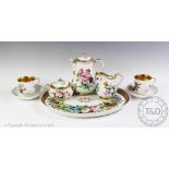 A KPM Berlin Tete a Tete coffee service, early 19th century, comprising: a coffee pot and cover,