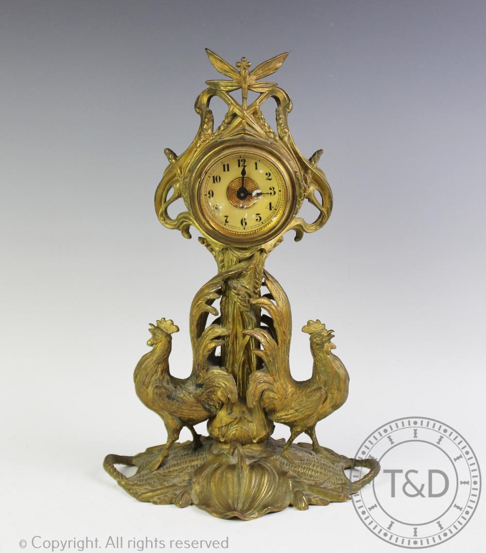 A French Art Nouveau gilt spelter figural mantel clock, modelled as two cockerels,