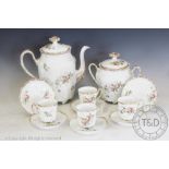 A 20th century Limoges coffee service, comprising: a coffee pot, a sugar bowl with cover,