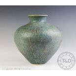 A large studio pottery vase possibly Elizabeth Currie, decorated with a mottled green glaze,