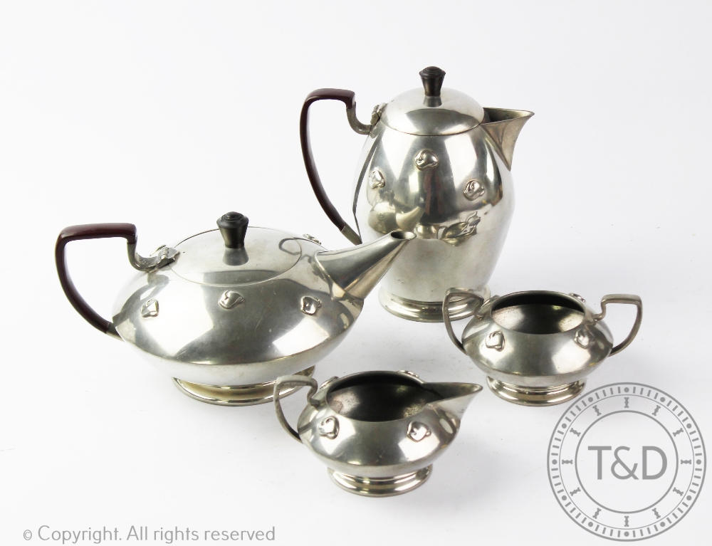 A Warric four piece Arts & Crafts pewter tea service,