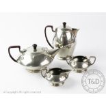 A Warric four piece Arts & Crafts pewter tea service,