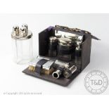 A Gentlemans chrome mounted glass travelling toilet set, in leather case, 22.