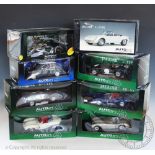 Eight boxed Auto Art 1:8 scale diecast model vehicles to include; Mini Cooper, Jaguar C-Type,