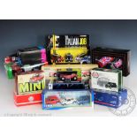 Thirty one boxed diecast Minis, by various makers including Corgi and Maisto,