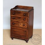 A 19th century mahogany bedside cupboard, with three drawers over a cupboard, 79cm H x 45.