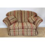 A two seater settee, with Indian style paisley upholstery,