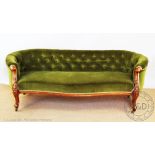 A Victorian carved walnut serpentine Chesterfield / conversation settee,