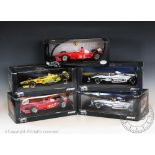 Five boxed Hotwheels Formula One racing car models, 1:18 scale,