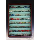 Two display cases containing approximately eighty diecast vehicles by various makers, all unboxed,