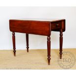 A 19th century mahogany Pembroke table, with drawer, on turned and tapered legs,