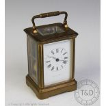A brass repeating carriage clock,
