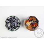 Two paperweights comprising;
