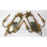 A pair of French 19th century gilt brass girandole, each surmounted with moulded foliate crests,