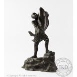 A Japanese bronze group, Meiji Period, modelled as a man grappling with a large carp,