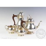 A George III style silver four piece tea and coffee service, Barker Ellis Silver Co,