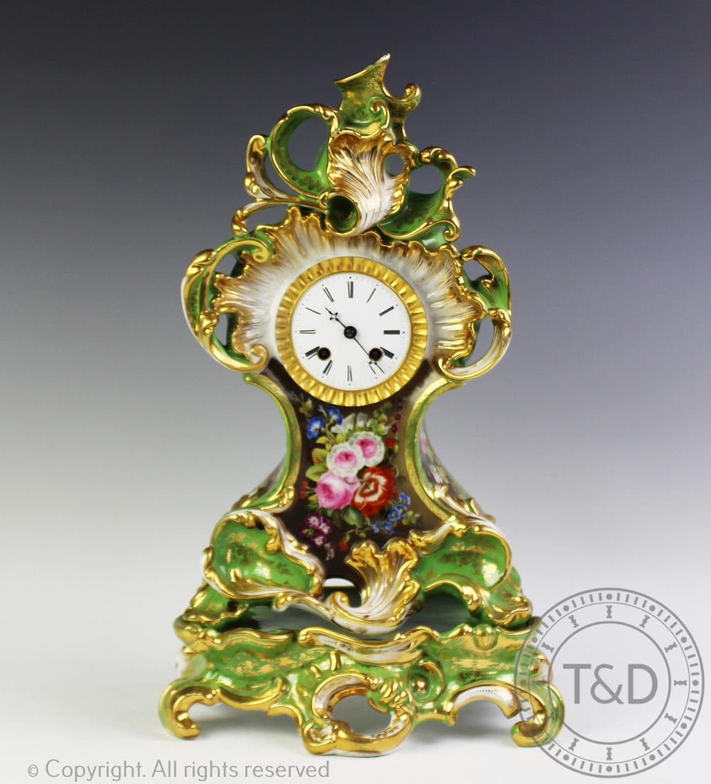 A 19th century Paris Porcelain green glazed mantel clock on stand,