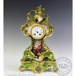 A 19th century Paris Porcelain green glazed mantel clock on stand,