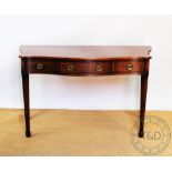 A pair of reproduction George III style mahogany serpentine serving tables / side tables,