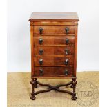 An early 20th century walnut music cabinet, with five drawers, on tuned legs, 91cm H x 51.