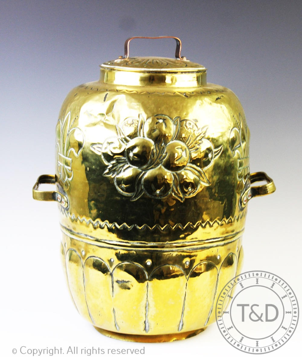 A late 19th century Dutch brass 'Doofpot' and cover with later copper strap handle,