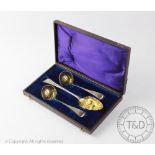 A Victorian cased strawberry set comprising: a pair of sifter spoons, Chawner & Co, London 1875,