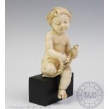 A late 18th century carved ivory cherub, possibly Dieppe,