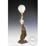 A bronzed spelter and composition figural table lamp, modelled as a maiden,
