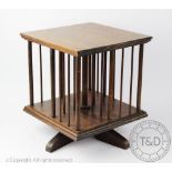 An Edwardian mahogany revolving bookcase of small proportions,