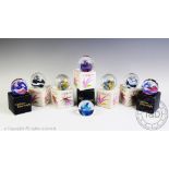 Eight Caithness glass paperweights from the Collectors' Club Reflections collection,