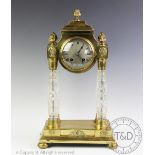 An early 20th century Hamburg American Clock Company portico clock with key and pendulum,