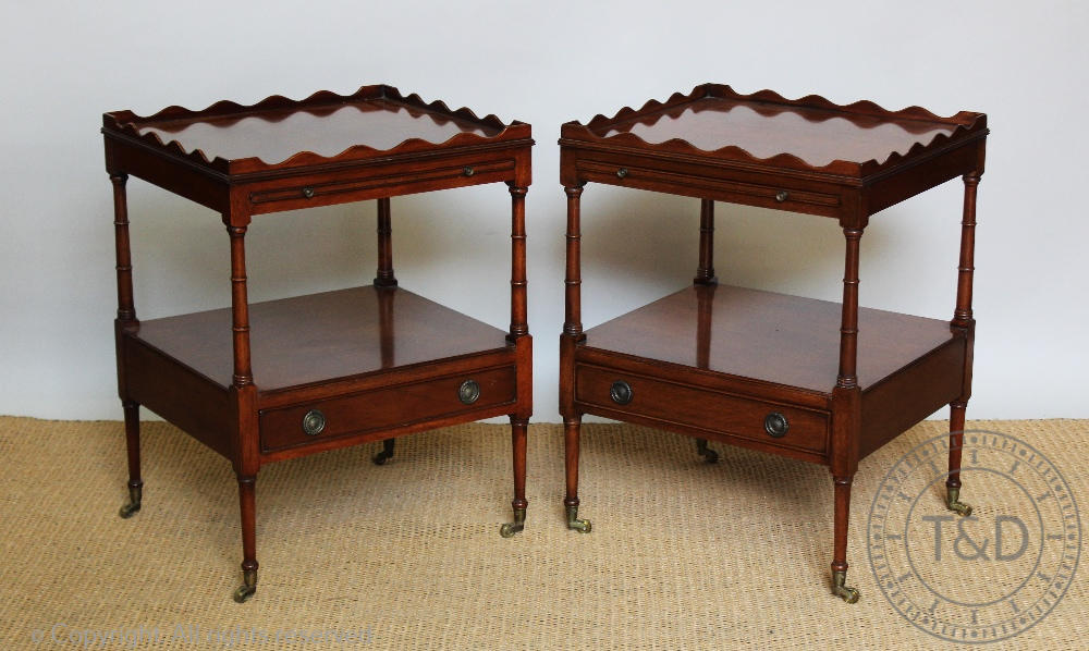 A pair of reproduction Regency style mahogany two tier side tables, with drinks slide and drawer,