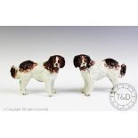 A pair of 19th century Staffordshire model St Bernard dogs, modelled standing, 18cm long,