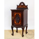 A late Victorian inlaid mahogany bedside cupboard, with raised back and panelled door,