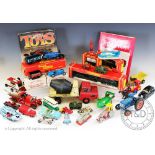 An assortment of vintage toys, to include Tri-Ang and Hornby OO gauge loco and carriages,