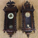 A walnut Vienna regulator wall clock, with Roman numeral dial and movement striking on a gong,