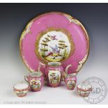 A French porcelain cabaret service, comprising: a large circular serving tray, 42cm wide,