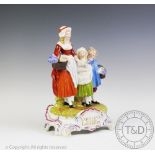 A Dresden porcelain advertising group 'Yardley's Old English Lavender', modelled as a mother,