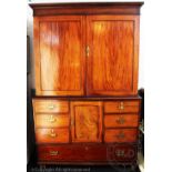 An early 19th century mahogany housekeepers cupboard,