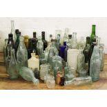 An assortment of stoneware and glass advertising bottles including some of local interest (Qty)