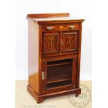 An Edwardian inlaid mahogany music cabinet,