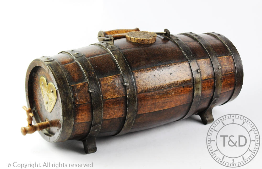 A naval type coopered oak rum barrel,