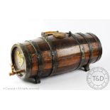 A naval type coopered oak rum barrel,