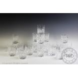 A collection of cut glass drinking glasses, to include twelve brandy balloons,