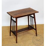 An Edwardian inlaid rosewood table, with rectangular top, and under tier, on tapered legs,