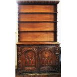 A Victorian and later carved oak bookcase cabinet,